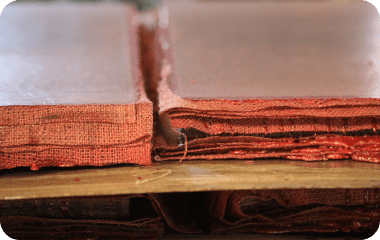 Resin-soaked RHINO composite pallet for concrete block machines