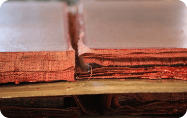 Resin-soaked RHINO composite pallet for concrete block machines